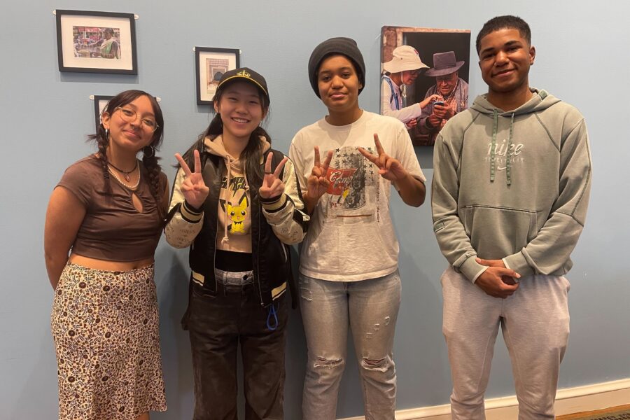 2 students stand next to each other facing the camera