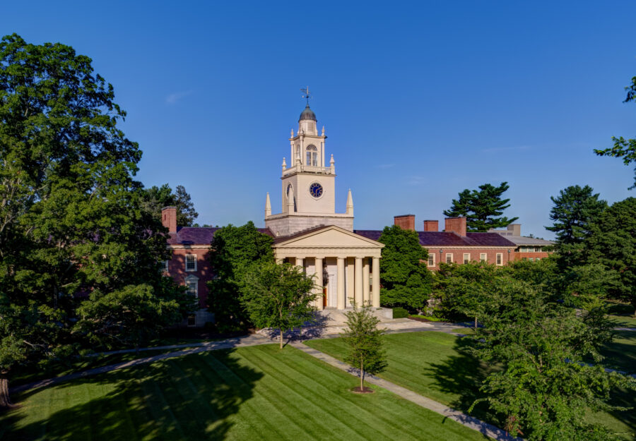 the classroom building Sam Phil on a summer day with blue sky above and green grass in foreground