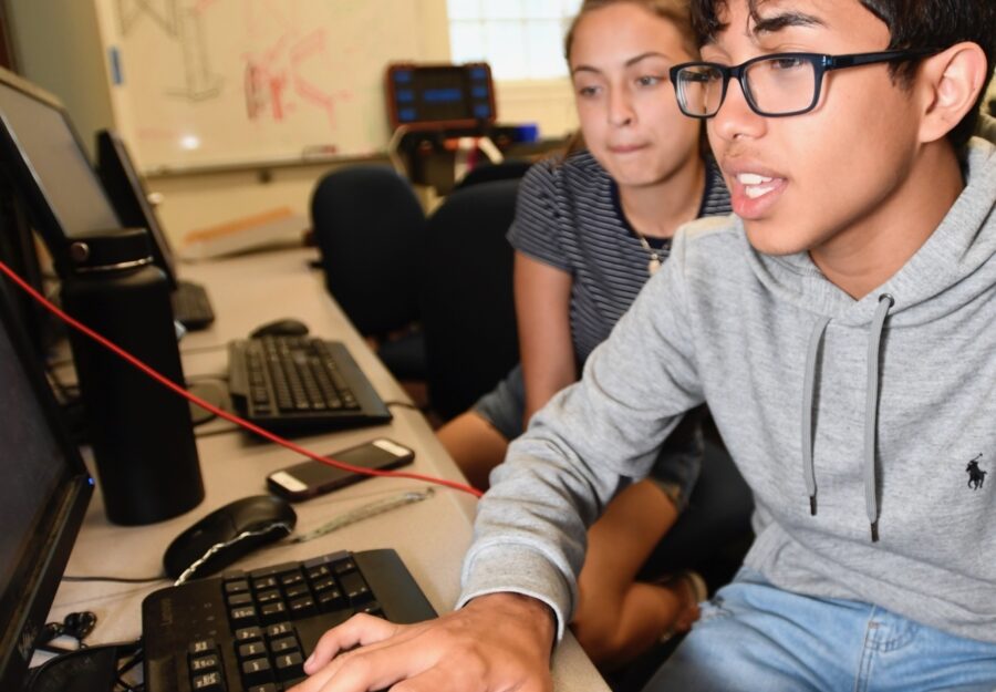two students working on computers
