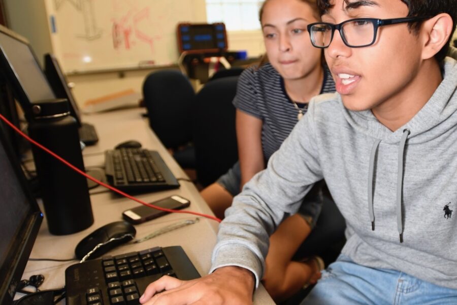 two students working on computers