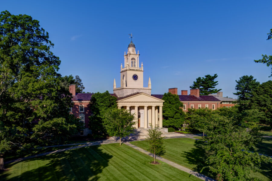 the classroom building Sam Phil on a summer day with blue sky above and green grass in foreground
